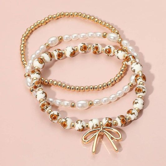 Brown/Gold Metal Bow Charm Pointed Ceramic Ball Pearl Bracelets (3pc) - Purpose + Passion Boutique
