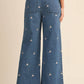 Denim Embroidered Floral Raw Hem Pants - Purpose + Passion Boutique